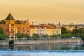 Awesome looking buildings and standout landmark buildings along a tributary of the Vltava River under the sunset