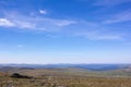 Awesome panorama for a postcard or calendar. Blue cloudy sky and mountain view in the distance. Nature of the Northern