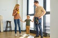 Awesome Parents With Son After Repair Home Renovation, Looking Happy Together