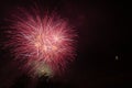 Awesome purple and green fireworks above a illuminated church