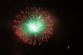 Awesome red, white and green fireworks above a illuminated church Royalty Free Stock Photo