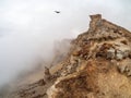 Awesome scenic mountain landscape with big cracked pointed stones closeup in misty morning. Sharp rocks background