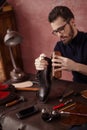 Awesome shoeshine man working at home