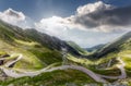 Awesome Sunny Landscepe in Romania Mountains. Scenic image Fairytale valley with Asphhalt road, and sky under sunlight on a