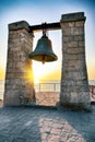 Awesome sunset over ruins of ancient city Tauric Chersonese - Chersonese old bell by the sea Royalty Free Stock Photo