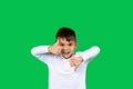 Awesome toddler boy shows like and dislikes to the camera on green background