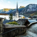 Awesome view on the lake Hallstatter and Hallstatt Lutheran Church. Wonderful Colorful Sunset in famous Hallstatt alpine village, Royalty Free Stock Photo