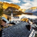 Awesome view on the lake Hallstatter and Hallstatt Lutheran Church. Wonderful Colorful Sunset in famous Hallstatt alpine village, Royalty Free Stock Photo