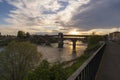 Awesome view of Ponte Coperto (covered bridge) over Ticino river in Pavia at sunset Royalty Free Stock Photo