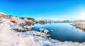 Awesome winter scenery of Moskenes village with ferryport and famous Moskenes parish Churc