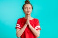 Awesome woman praying with closed eyes