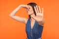 Awful odor, stink. Confused woman pinching nose and gesturing stop, ignoring bad breath Royalty Free Stock Photo