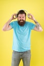 Awful sound. Hipster listen broken headphones music gadget. Hateful song. Music taste. Bearded guy dislike music Royalty Free Stock Photo