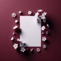 Awhite blank paper amidst cherry blossoms, set against a deep solid uniform background. Mockup, colorful background Royalty Free Stock Photo