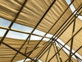 Awning in the midday sun against the sky. Royalty Free Stock Photo