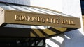 Awning over entrance with name of Edmonds City Hall in embossed gold letters