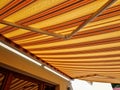 Awnings underline architectural appearance of your house. Royalty Free Stock Photo