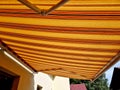 Awnings underline architectural appearance of your house. Royalty Free Stock Photo