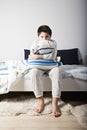 Awoken boy with pillow Royalty Free Stock Photo