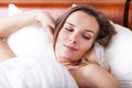 Awoken woman in bed Royalty Free Stock Photo