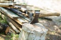 Ax, hatchet, axe. split a log with an ax. birch firewood in the Royalty Free Stock Photo