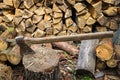 Ax, hatchet, axe. split a log with an ax. birch firewood in the background. wood Royalty Free Stock Photo