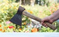 The ax in his hand. a man`s hand holds an axe Royalty Free Stock Photo