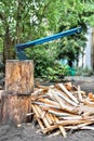 Axe on firewood chopping block with chopped wooden sticks for kindling home heating wood stove Royalty Free Stock Photo