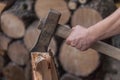 Heap of chopped wood, close up on the axe, cutting firewood and preparing winter wood Royalty Free Stock Photo