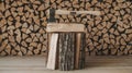 Axe resting on firewood stack against a backdrop of chopped wood Royalty Free Stock Photo