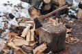 Axe and the split firewood. Royalty Free Stock Photo