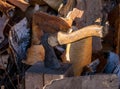Axe stuck in a log in the yard about a woodpile on the street Royalty Free Stock Photo