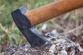 The axe in the tree. Tourist camp. Chopping wood in the forest in details. Royalty Free Stock Photo