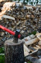 Axe and woodpile. Royalty Free Stock Photo