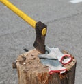 axe and work gloves on the wooden stump during the strike Royalty Free Stock Photo