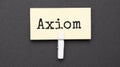 axiom text on paper with wihte clip. On black background Royalty Free Stock Photo