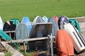 AXMOUTH, DEVON,ENGLAND - JULY 12TH 2020: Upturned rowing boats by the side of the river Axe at Axmouth Royalty Free Stock Photo