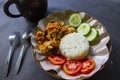 Ayam geprek or chicken crush or chicken smashed is indonesian food made from made fried chicken pounded with chilli and garlic. Royalty Free Stock Photo