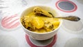 Ayam Masak Lemak Cili Api/ Chicken stew in coconut milk- traditional Malay cuisine in white bowl on table