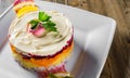 Ayered salad with herring, beets, carrots, onions, potatoes and eggs close-up on a plate Royalty Free Stock Photo
