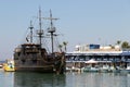 AYIA NAPA, CYPRUS - JULY 07, 2017: The port of the resort with the small fishing boats and wooden galleon Black Pearl for tourist Royalty Free Stock Photo