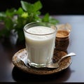 Ayran drink with mint in glass on wooden table