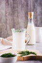 Ayran homemade yogurt drink with dill in a glass on the table vertical view Royalty Free Stock Photo