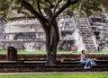 Tourist woman is sitting alone sit rest at Wat Ratchaburana