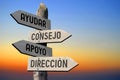 Ayudar, consejo, apoyo, direccion - Spanish/ help, advice, support, direction - English - wooden signpost, sunset sky