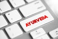Ayurveda - alternative medicine system with historical roots in the Indian subcontinent, text concept button on keyboard