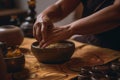 An Ayurvedic abhyanga massage in progress, showing hands rhythmically prepare herbal oils to a warm skin. Capture the rejuvenating