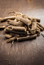 Famous ayurvedic herb Licorice root or Liquorice root or Mulethi on wooden surface.