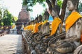 Ayuthaya, Thailand - 13 February 2014: Rows of buddha statue Wat Yai Chaimongkhon