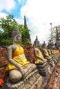 Ayuthaya, Thailand - 13 February 2014: Rows of buddha statue Wat Yai Chaimongkhon,